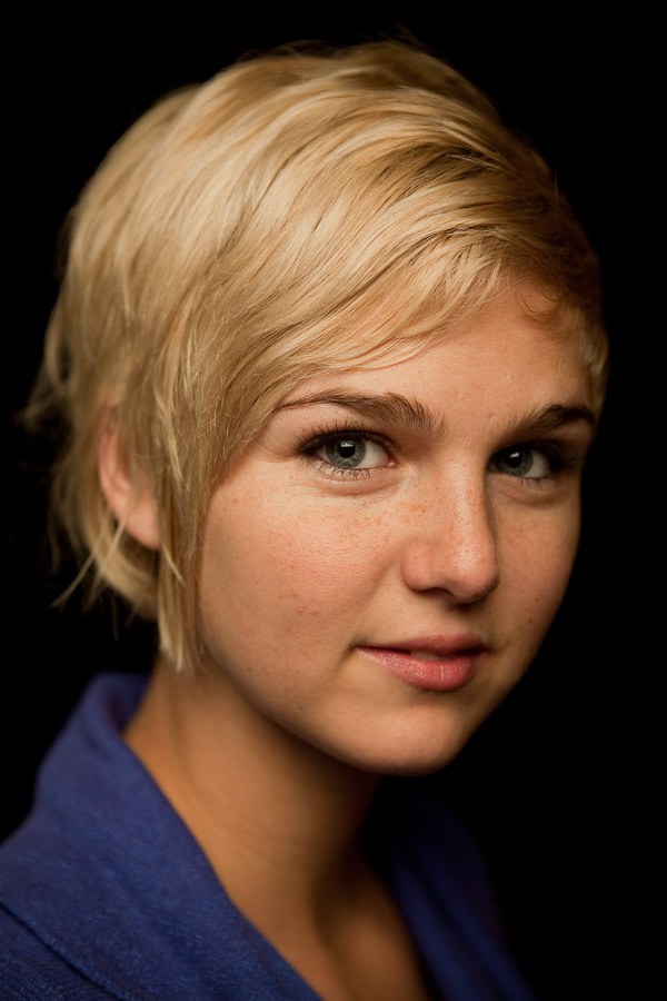 Portrait of Chloe Camilla against a dark background, 2010