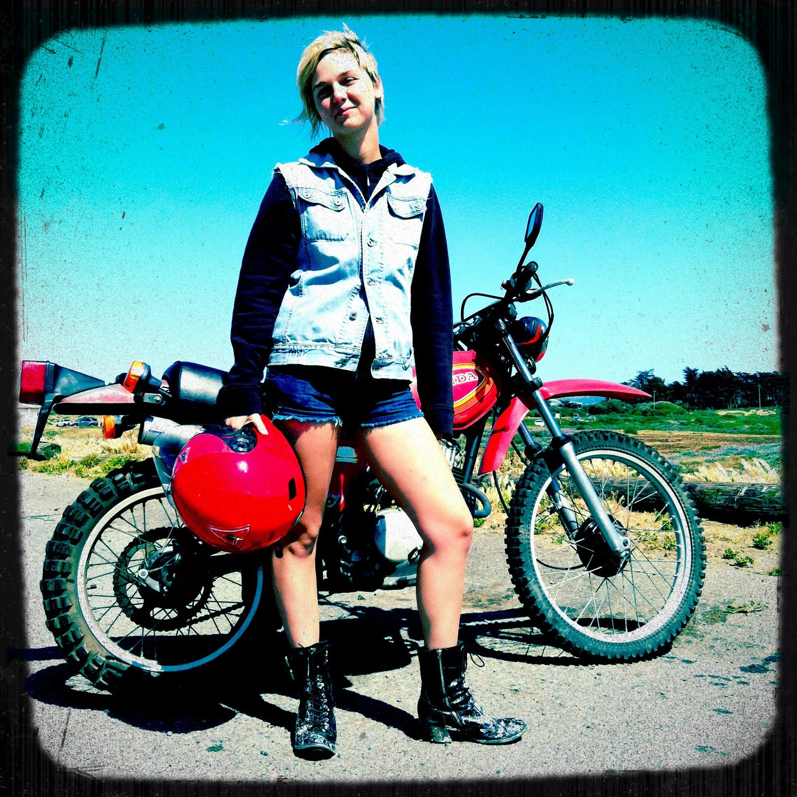 Chloe Camilla sitting on a motorcycle, 2011